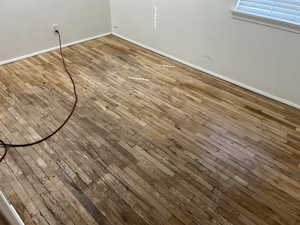 Detailed view of wood finished floors and baseboards