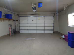 Garage featuring a garage door opener