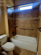 Full bath featuring shower / bathtub combination and tile patterned floors
