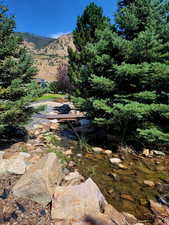 View from the from side yard of the pond that the brook flows into