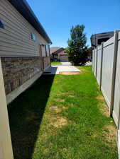 View from the backyard side gate to the RV pad & the garage man-door.