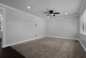 Empty room with ornamental molding, recessed lighting, dark wood finished floors, ceiling fan, and a textured ceiling