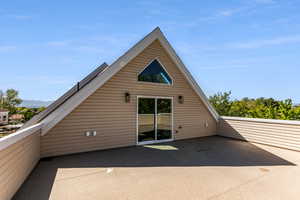 Rear view of property with a patio area