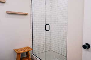 Full bathroom featuring a stall shower