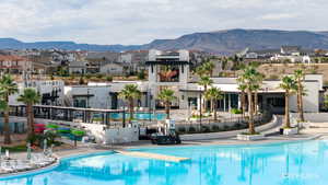 Community pool featuring a mountain view and a residential view