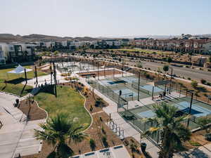 Aerial overview of property's location with nearby suburban area and a mountain backdrop