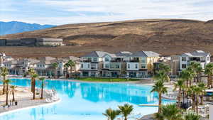 Community pool featuring a mountain view and a residential view