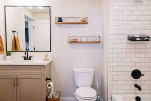 Full bathroom with vanity and shower / washtub combination