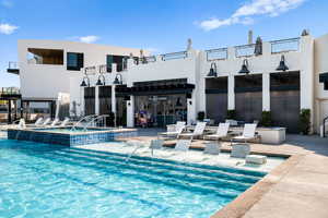 View of swimming pool with a pool with connected hot tub