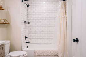 Full bathroom featuring shower / tub combo and vanity