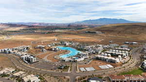 Aerial overview of property's location featuring mountains and a pool