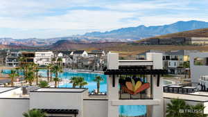 View of pool with a mountain view and a residential view