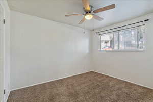 2nd bedroom with carpet and a ceiling fan