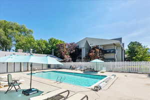 Community pool with a patio area