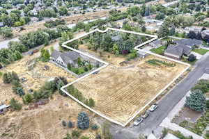 Aerial view of residential area with property boundaries highlighted