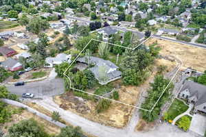 Aerial perspective of suburban area featuring property parcel outlined