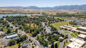 Aerial perspective of suburban area with a water and mountain view
