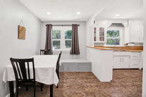 Dining area with recessed lighting