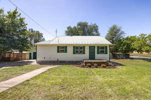 View of front of home with a metal roof