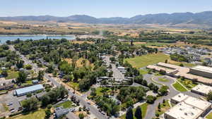 Aerial perspective of suburban area with a water and mountain view