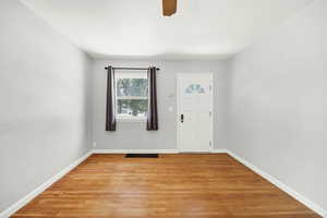 Entryway featuring light wood-style floors and ceiling fan