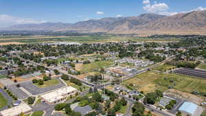Aerial perspective of suburban area with a mountainous background