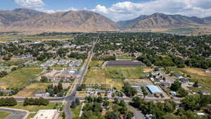 Aerial overview of property's location with mountains and nearby suburban area