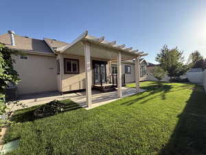 Rear view of property with a patio and stucco siding