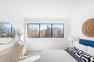 Bedroom with a mountain view and recessed lighting