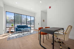 Dining area featuring light wood-style flooring and recessed lighting