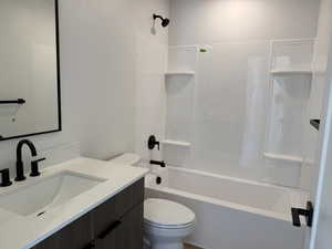 Full bathroom with vanity and washtub / shower combination