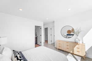 Bedroom with baseboards and recessed lighting