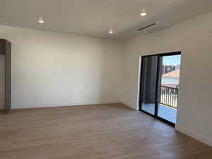 Unfurnished room featuring light wood-style flooring and recessed lighting