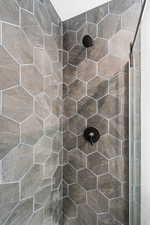 Full bath with a tile shower