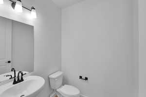 Bathroom with a sink and toilet