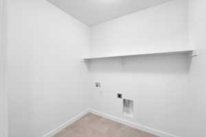 Laundry room with washer hookup and hookup for an electric dryer