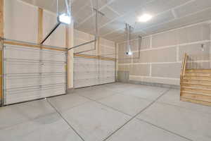 Garage featuring a garage door opener