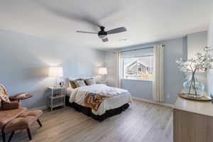 Bedroom with light wood-type flooring and ceiling fan
