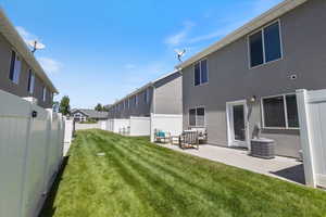 Fenced backyard featuring a patio area
