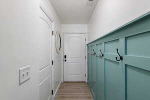 Mudroom with light wood-type flooring