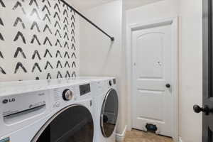 Laundry area with washer and clothes dryer