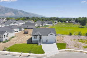Aerial view of residential area featuring a mountainous background