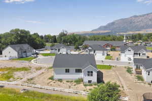 Aerial view of residential area featuring a mountainous background
