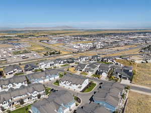 Aerial overview of property's location with a mountain backdrop and nearby suburban area