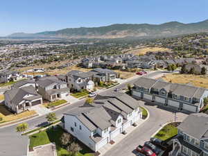 Aerial perspective of suburban area featuring a mountain backdrop