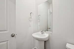 Half bath featuring toilet