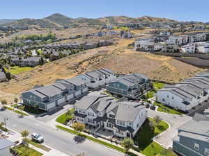 Aerial view of residential area featuring mountains