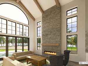 Lobby featuring high vaulted ceiling and beam ceiling