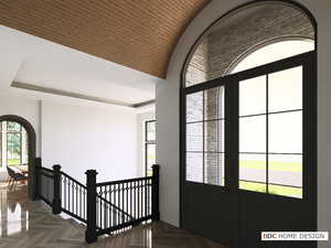 Foyer entrance with arched walkways and wooden ceiling
