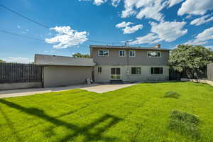 Back of property with a patio area, a fenced backyard, entry steps, and brick siding